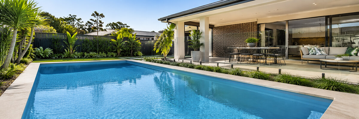 Australian backyard pool with clear water and outdoor living area